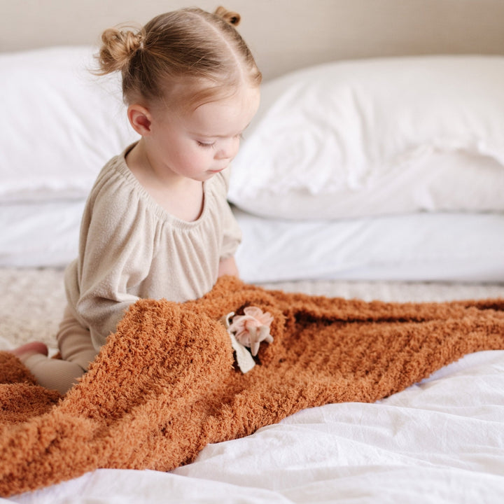 Warmth and comfort define the Saranoni Ribbed BAMBONI¨ Receiving Blanket in Ginger for sweet Baby girl blankets.