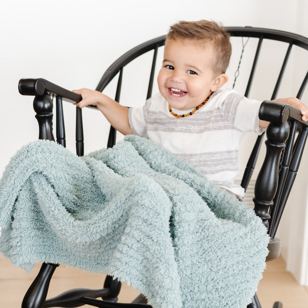 Cozy Saranoni Ribbed BAMBONI¨ Toddler Blanket in Surf, perfect for naps and cuddles.