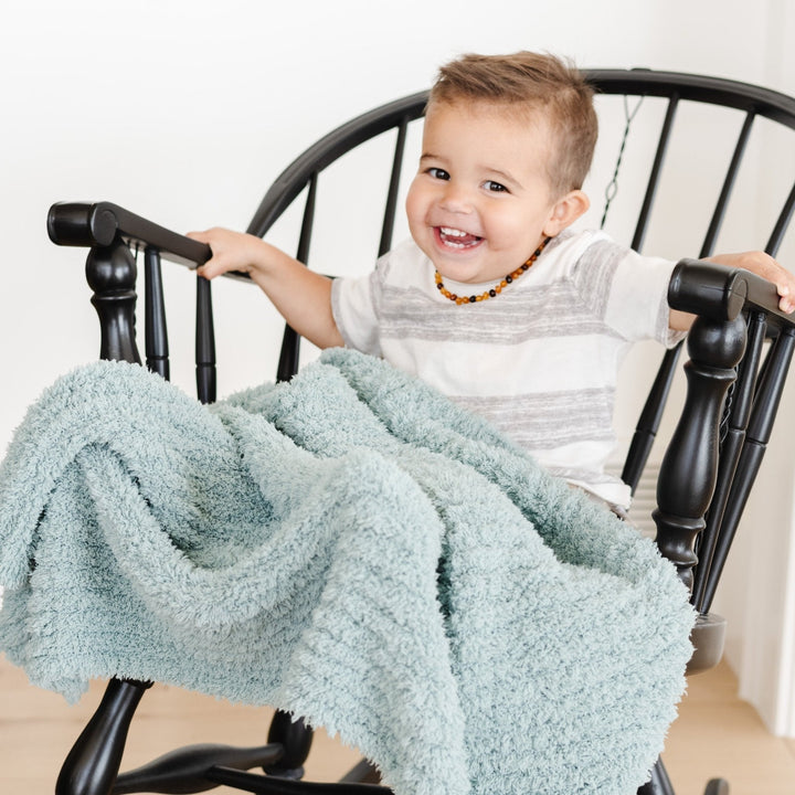 Cozy Saranoni Ribbed BAMBONI¨ Toddler Blanket in Surf, perfect for naps and cuddles.