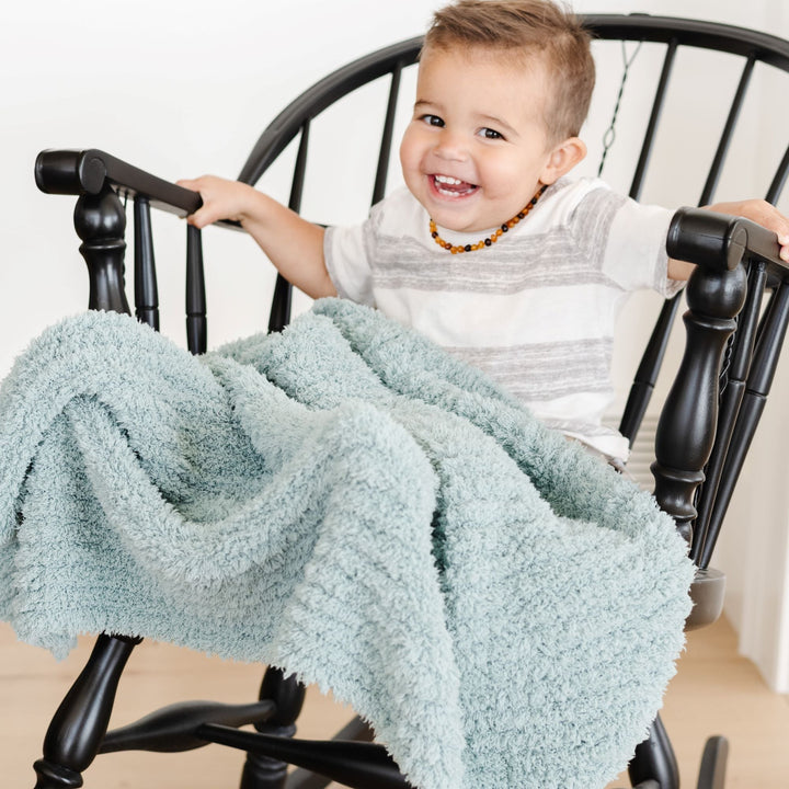 Perfect toddler blanket for bedtime, Saranoni Ribbed BAMBONI¨ Blanket in Surf hugs gently.