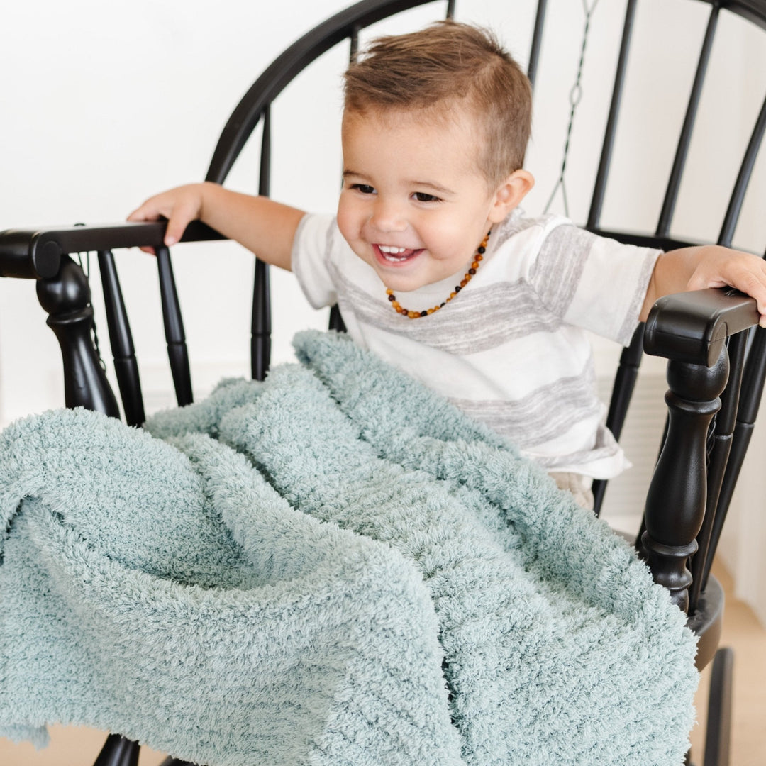 Cuddly and plush, Saranoni Ribbed BAMBONI¨ Blanket in Surf is a best toddler blanket choice.