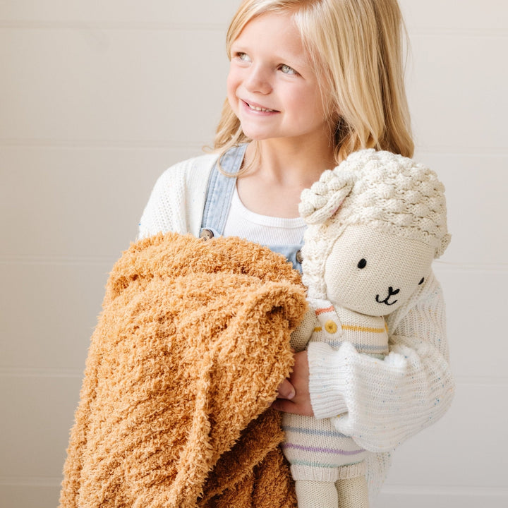 Keep your toddler cozy with the Saranoni Ribbed BAMBONI¨ Blanket in Golden during naps.