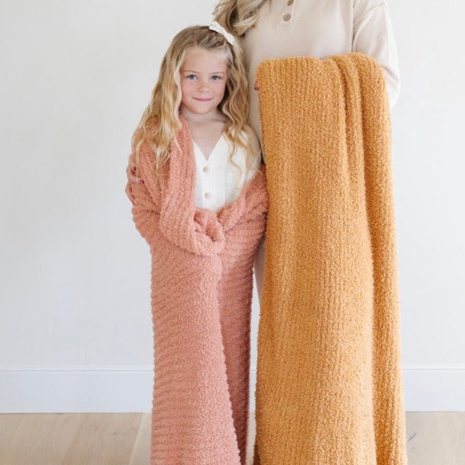 Little ones will love the Saranoni Ribbed BAMBONI¨ Blanket shown here in Sun-Kissed, a soft baby blanket.