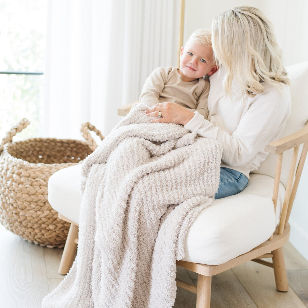 A cozy essential, the Saranoni Ribbed BAMBONI¨ Toddler Blanket Moonbeam suits boys and girls.