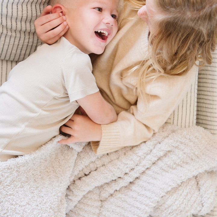 Saranoni Ribbed BAMBONI¨ Blanket in Moonbeam, a soft baby blanket perfect for quiet naps.