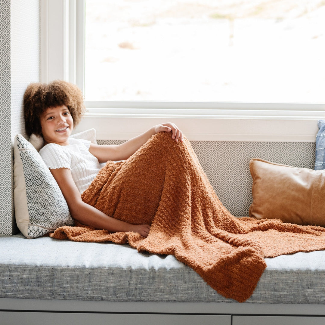 Soft baby blankets from Saranoni Ribbed BAMBONI¨ in Ginger, perfect for little ones.