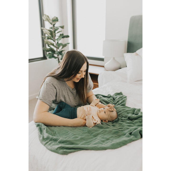 Soft and stylish, the Little Unicorn Deluxe Muslin Quilt - Sage delivers warmth and quality in muslin quilts.