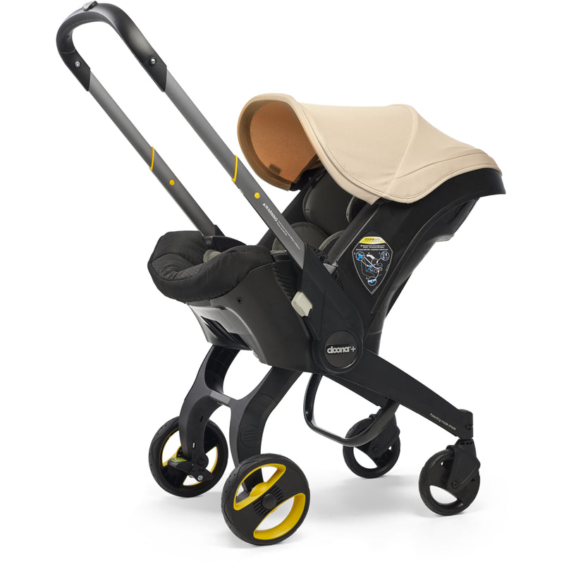 doona car seat and stroller in beige