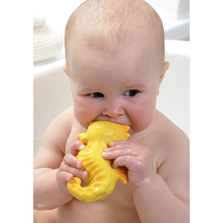 Infant chewing on CaaOcho seahorse, an ideal newborn bath toy for sensory development.
