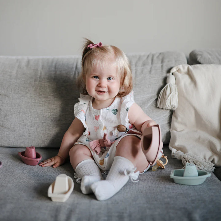 Charming Petal Mushie Bath Boats are ideal bath toy storage companions after playtime.