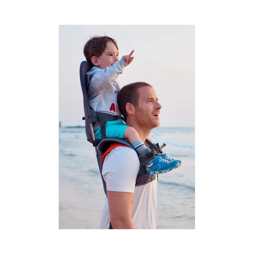 Grey shoulder carrying being used at the ocean