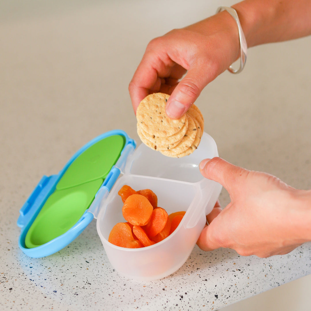 person removing snacks from bbox ocean breeze snack containers