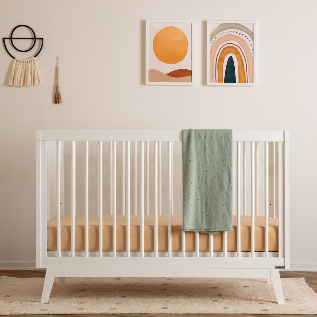 durable wooden crib in baby nursery