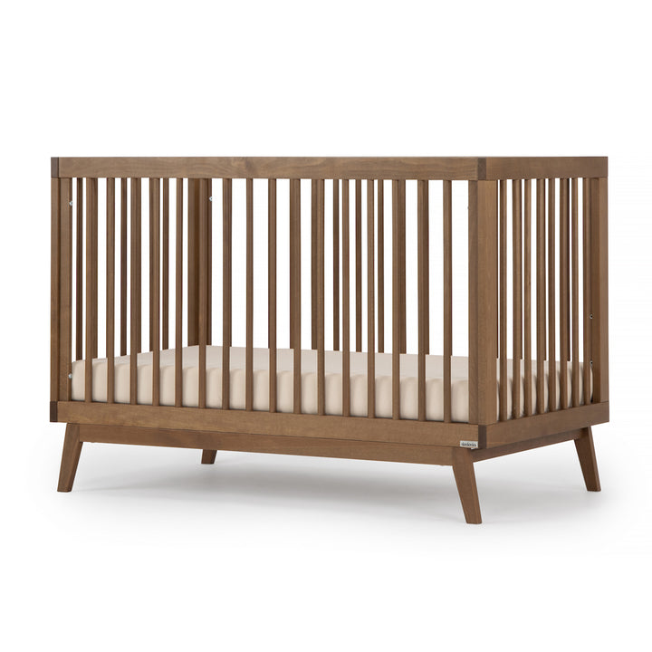 Warm walnut Dadada Soho 3-in-1 Convertible Crib showcased as a beautiful crib for babies.