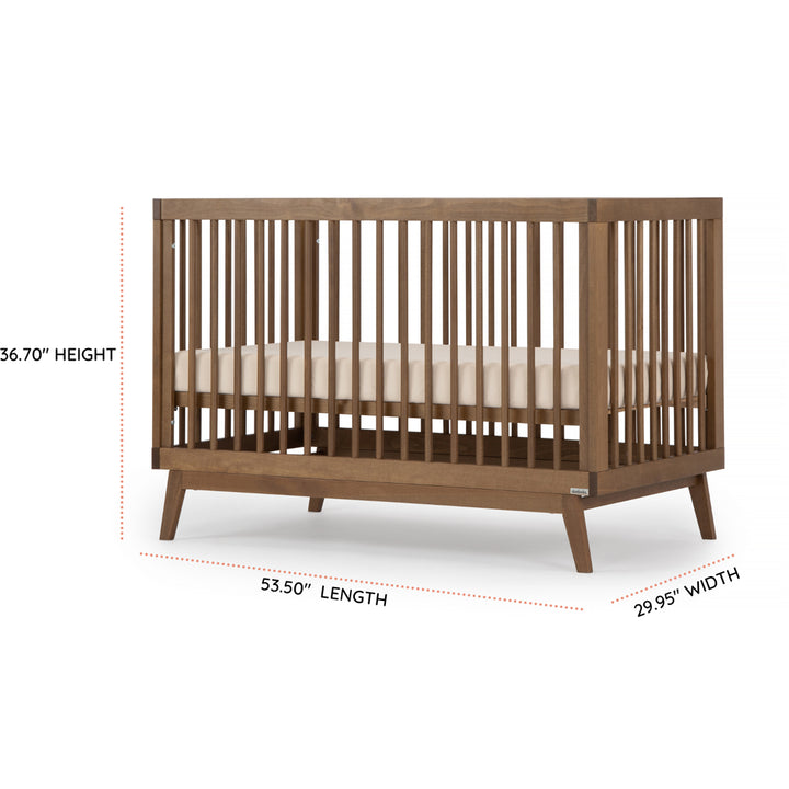 Close view of the Dadada Soho 3-in-1 Convertible Crib in walnut finish shown as a baby crib set.