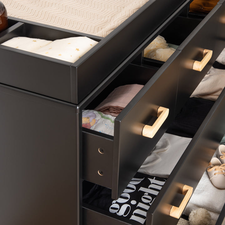 Contemporary charm elevates the Dadada Soho 2.0 5-Drawer Dresser in Black/Natural, one of the best nursery dressers.