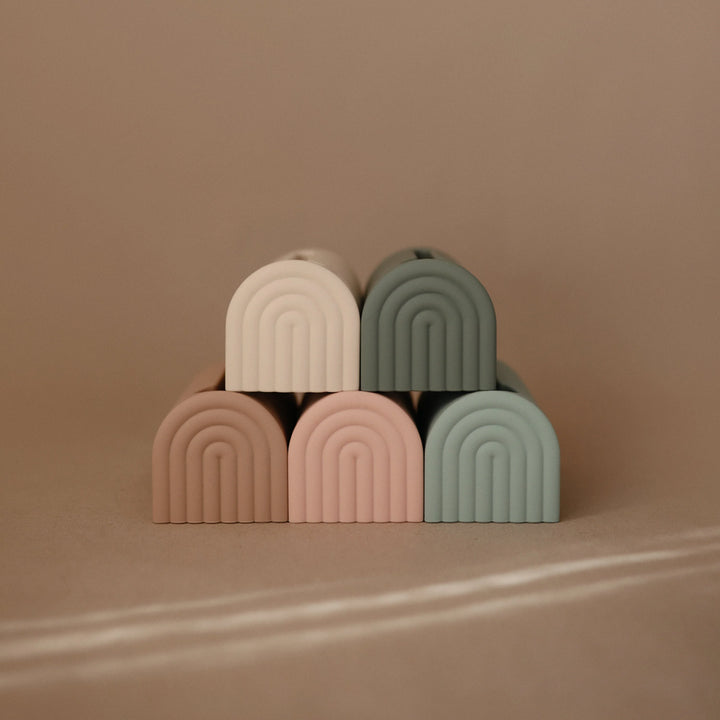 Mushie Spout Covers Stacked Bath Time Safety Product Multiple Mushie spout covers stacked to ensure safe and comfortable bath experiences