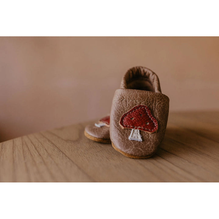 wooden table and with montana created leather star night brown all natural baby moccasins 