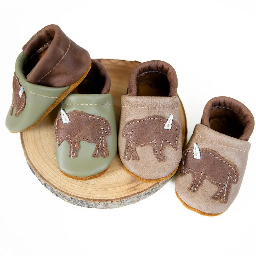 chai and lichen handcrafted leather baby moccosans with bison detail and adjustable back for flexible baby foot fit by starry knight design