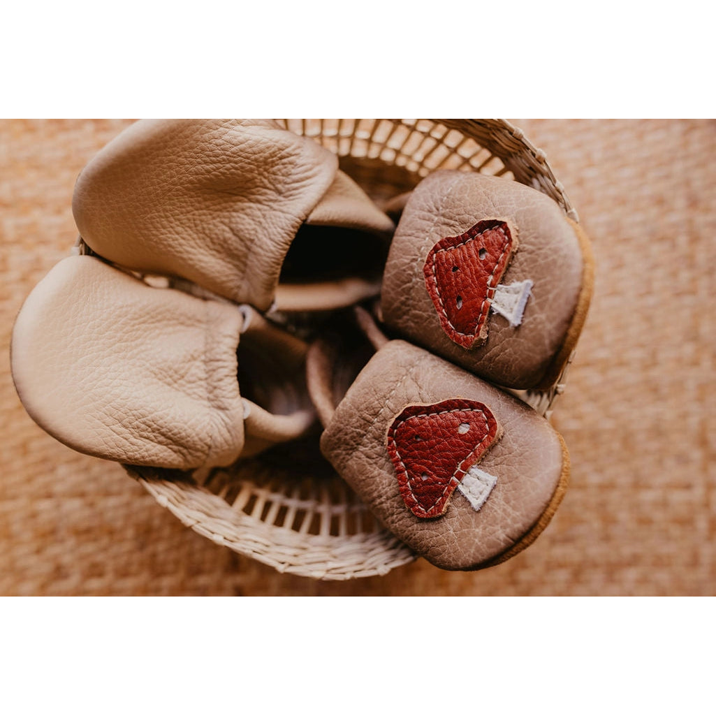 montana hand crafted brown leather infant and toddler moccs with red mush room motif 