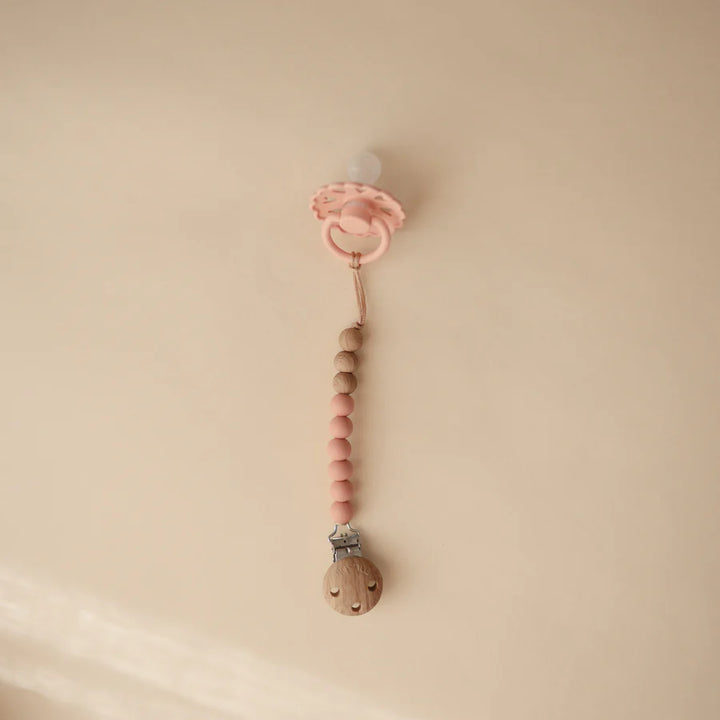 Mushie Eva Soother Pacifier Clip in Powder a soft and safe accessory for your baby's comfort