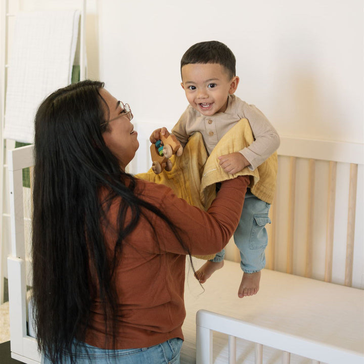 Soft and airy Little Unicorn Organic Cotton Muslin Baby Quilt - Swallows shown styled, showcasing one of the most adorable baby quilts designs.