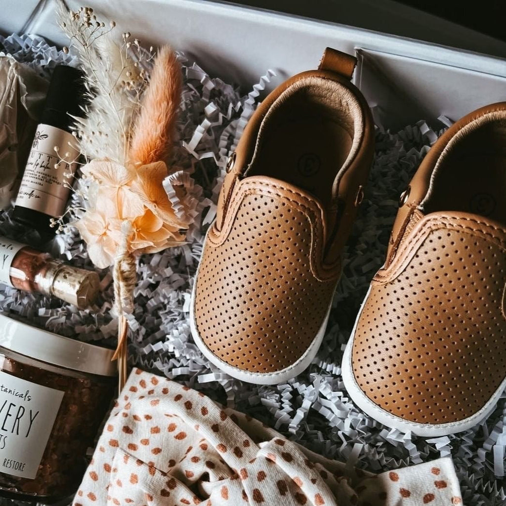 Little Love Bug Company Tan Quinn shoes in a box.