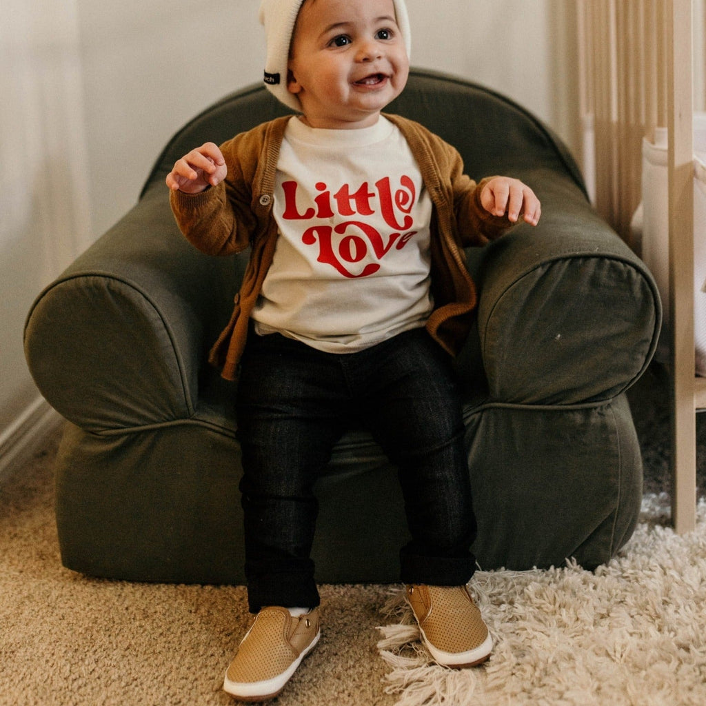 Toddler wearing the tan Quinn shoes, made by Little Love Bug Co.