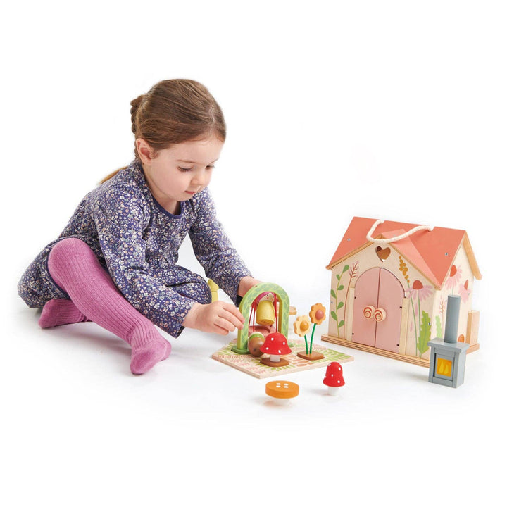 child playing with tender leaf toys wooden rosewood cottage included garden and dolls  