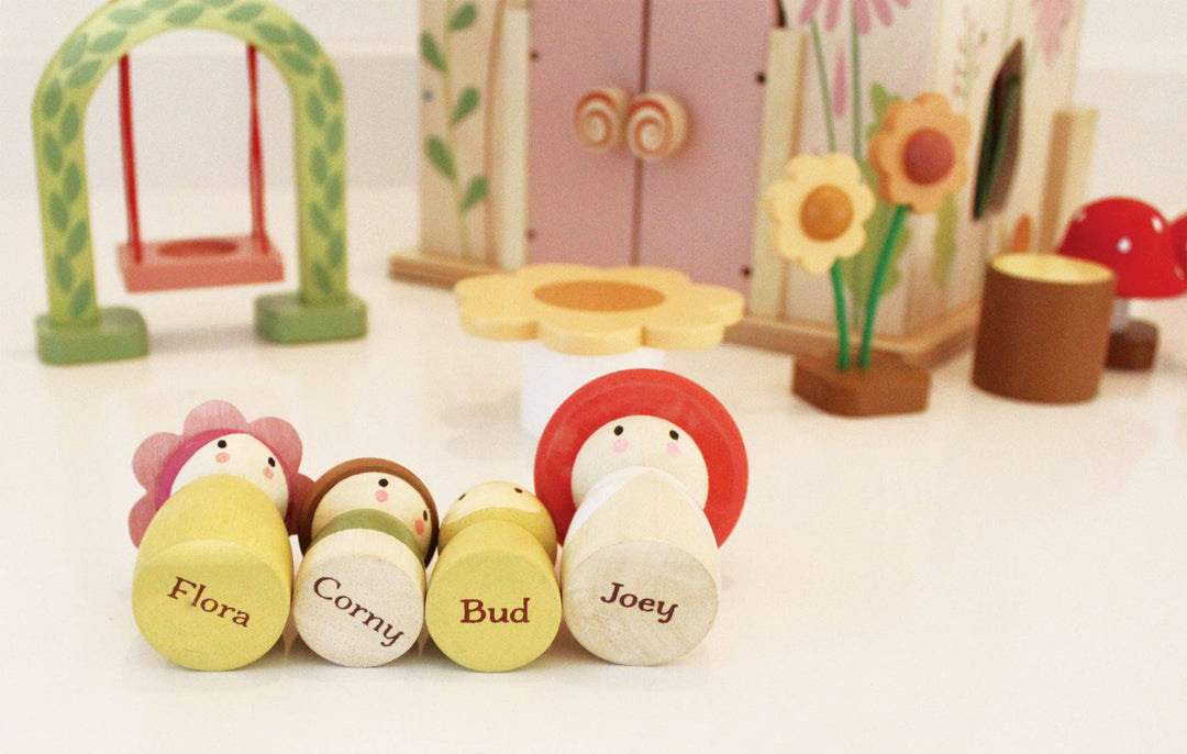 set of handcrafted tend leaf cottage wooden dolls included in rose wood dollhouse set 