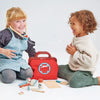 kids playing pretend with wood doctor kit
