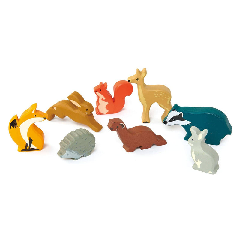 assortment of wooden toy forest animals that are in the tender leaf wood land animals set 