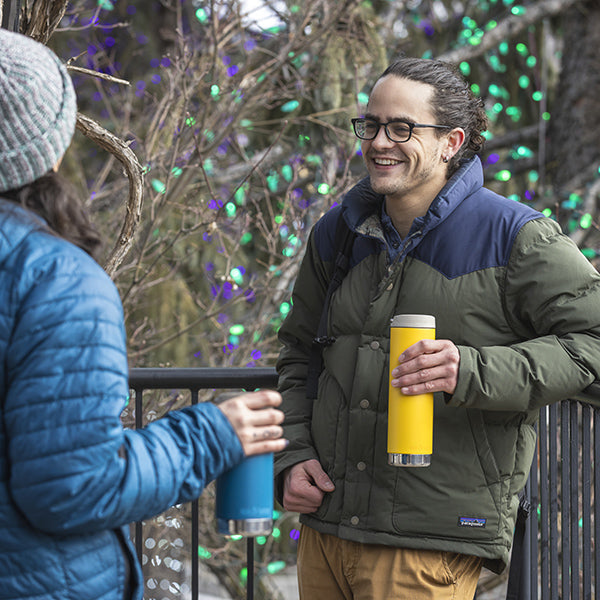 Winter coat scene with Yellow Klean Kanteen 20oz TKWide with Cafe Cap, minimalist and wide mouth.