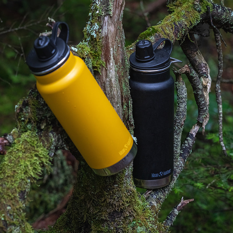 Close-up of Black Klean Kanteen 32oz TKWide with Chug Cap, chip resistant finish for outdoor adventures.