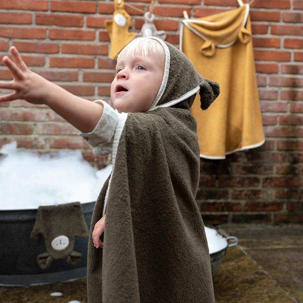 toddler in bear hooded towel