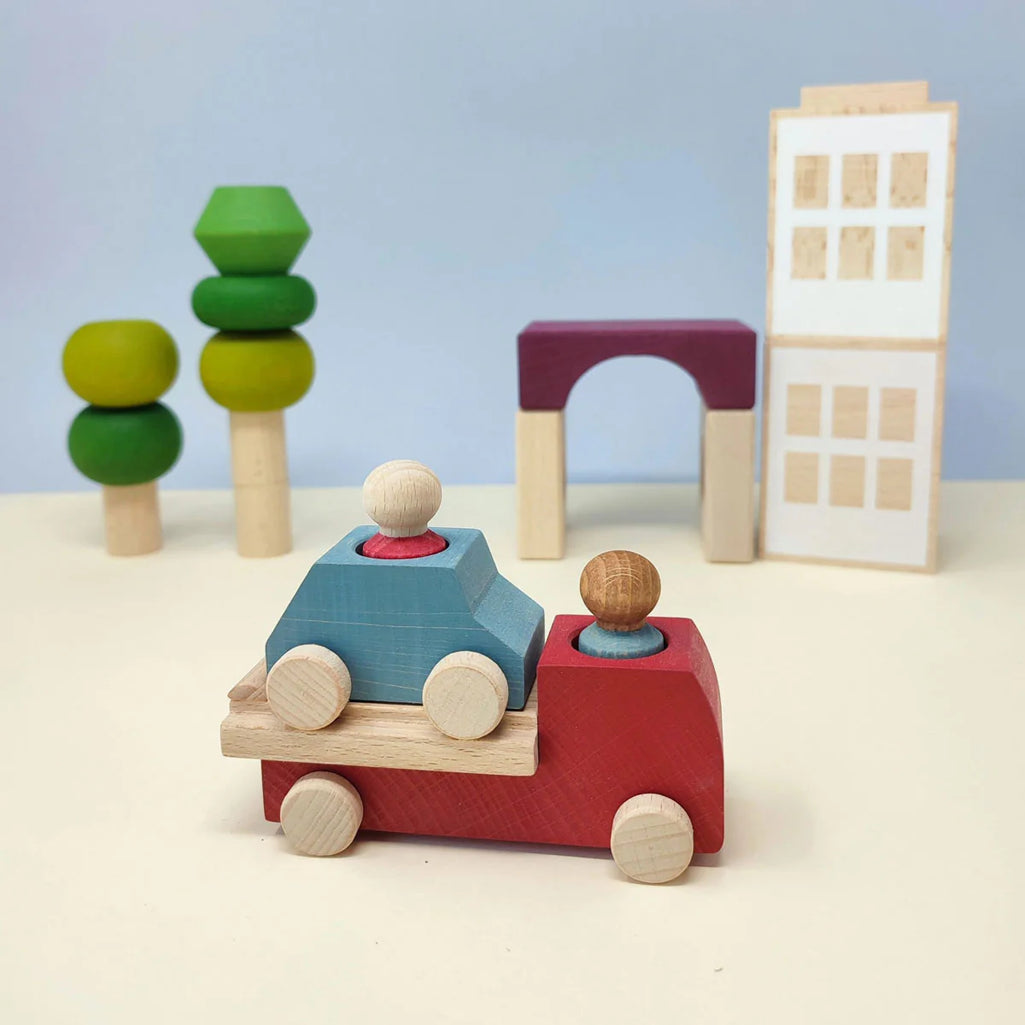 A Candylab Toys wooden pizza van, placed in a pretend-play city, showing the imaginative possibilities for kidsÕ playtime.
