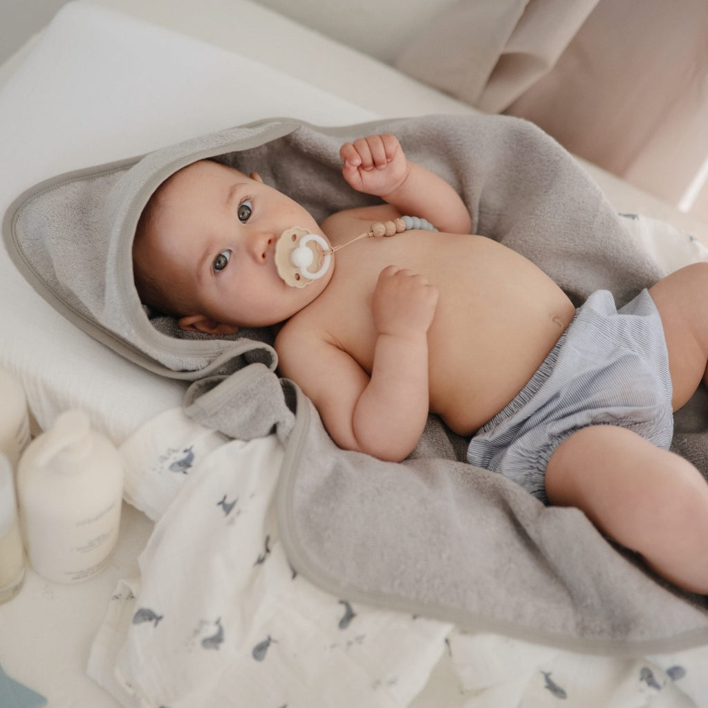 Baby in gray towel