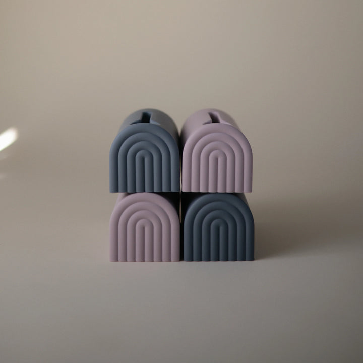 Mushie Spout Covers Stacked Stacked spout covers in various colors perfect for providing safety and protection during bath time