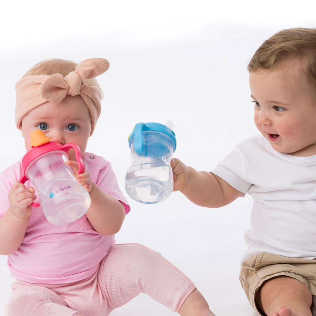 babies holding transition cups by bbox best sippy cups