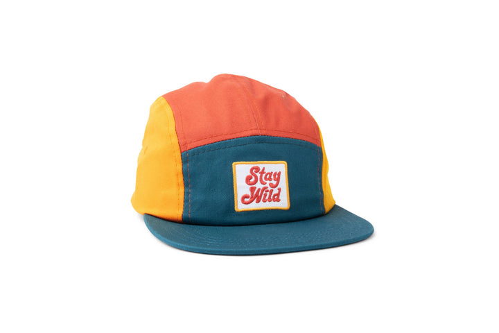 Trek Light's Stay Wild camp hat shown alone in a colorful orange, yellow and teal blend