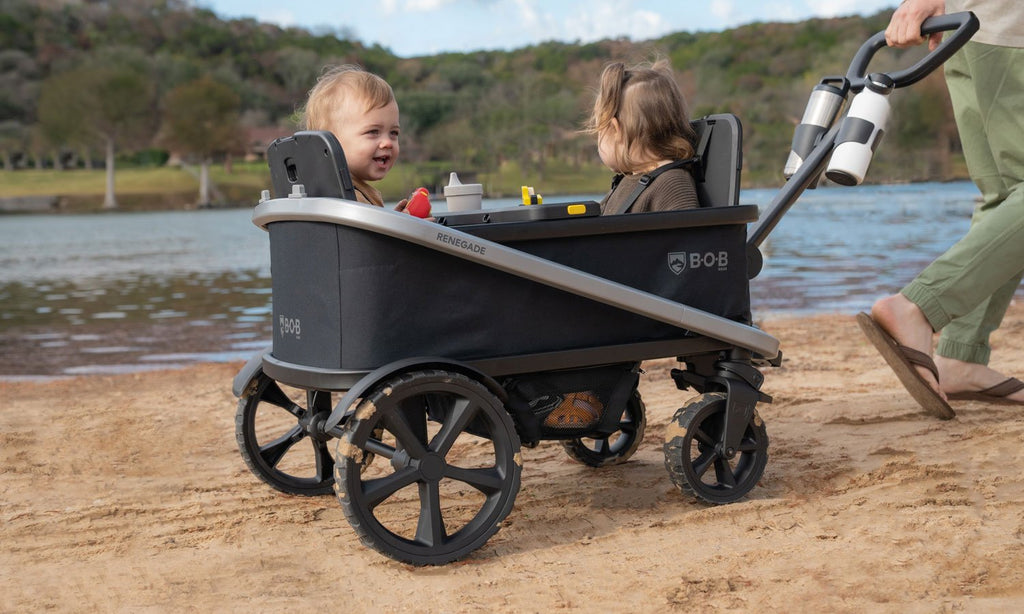 babies in bob renegade folding stroller wagon outdoors