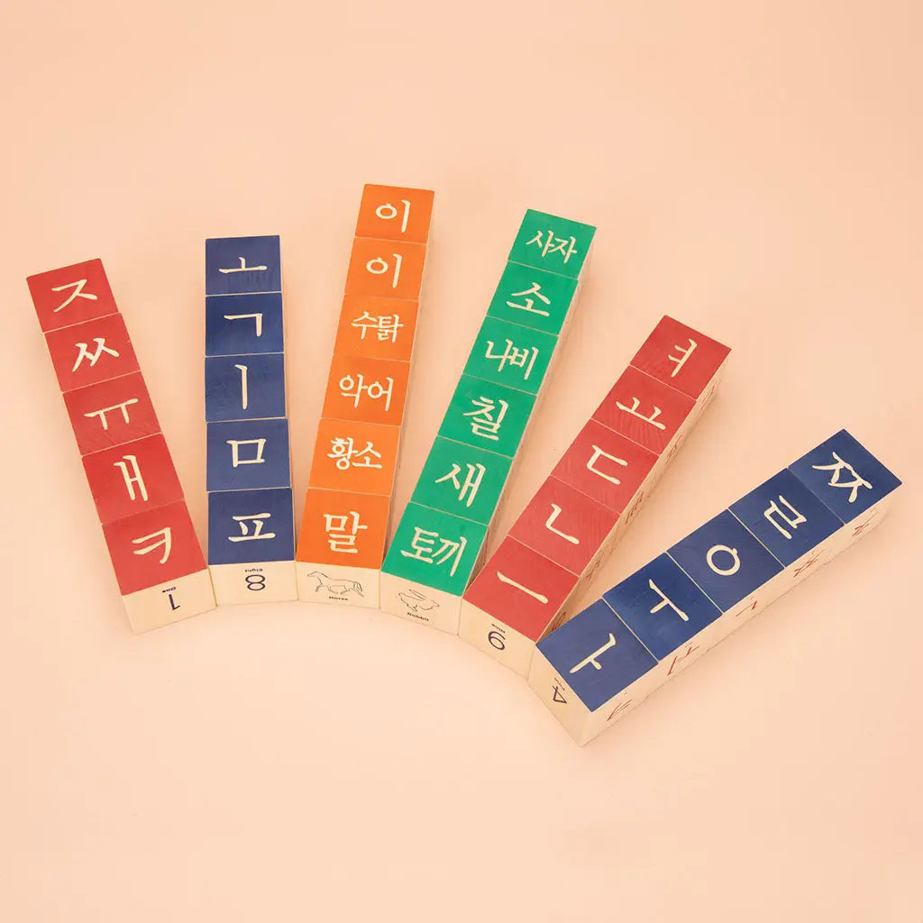 Children's wooden block set featuring Hangul and Korean numerals, laid out to show 32 blocks. 