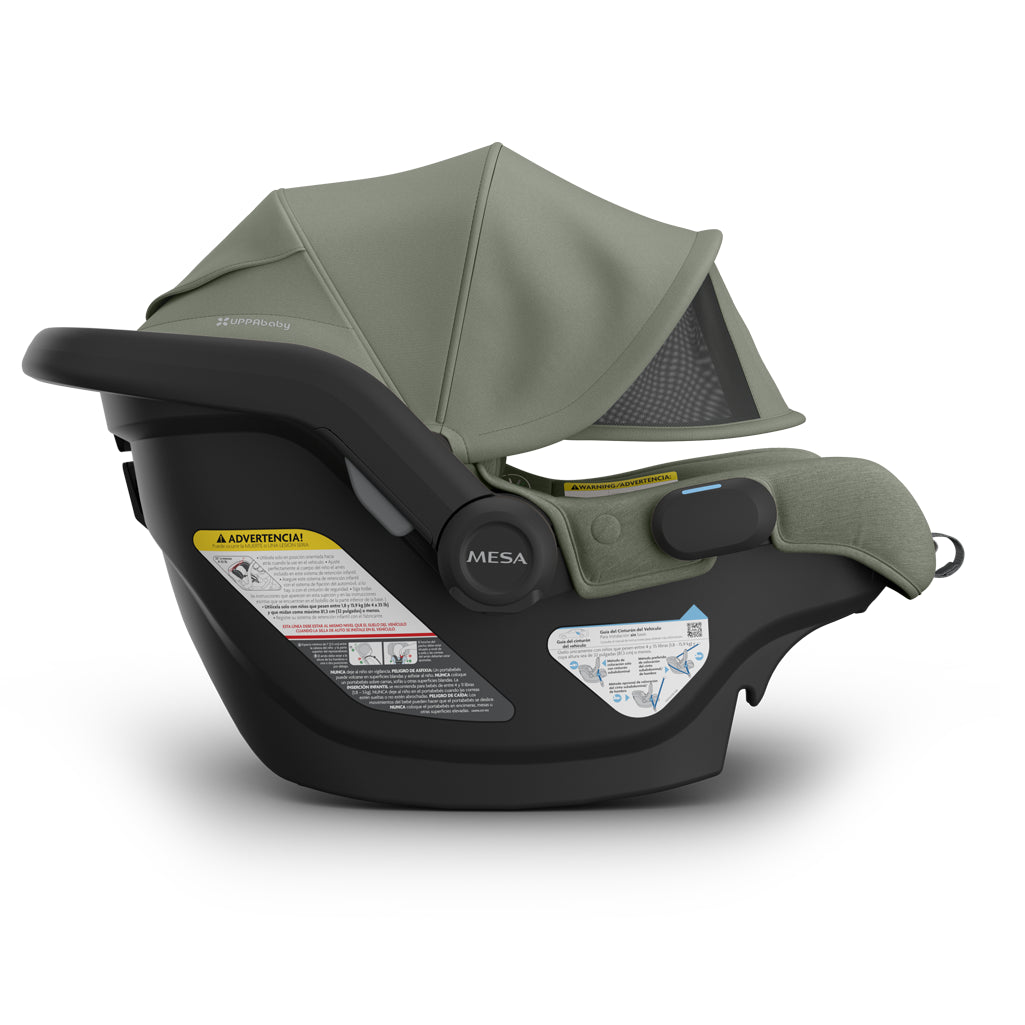 Side three-quarter view of Uppababy Mesa V3 Infant Car Seat Evelyn green displaying infant safe stroller travel system