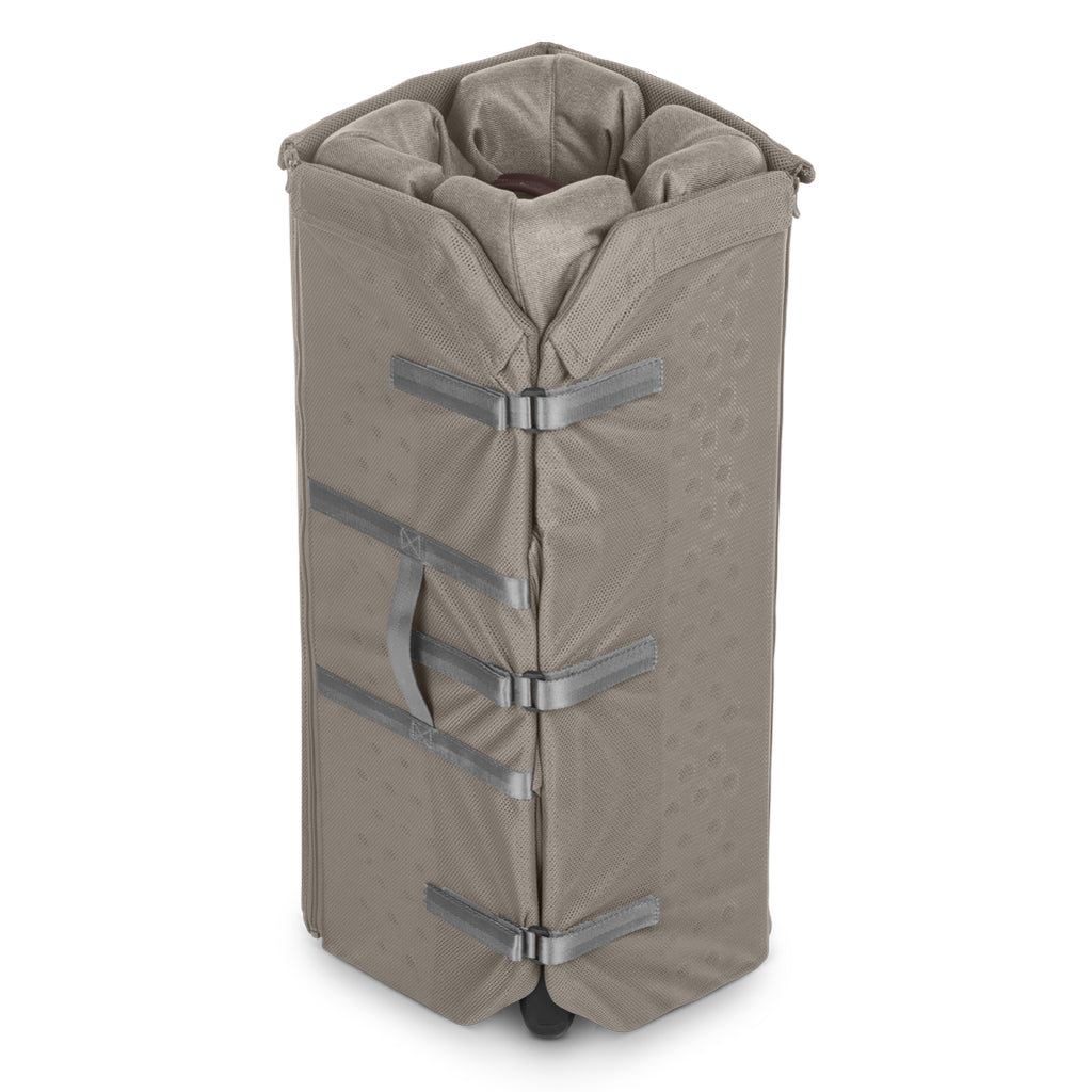 Uppababy Remi travel playard in Wells, crafted with Dark Taupe Mélange fabric. A best travel crib and playard for modern parents.