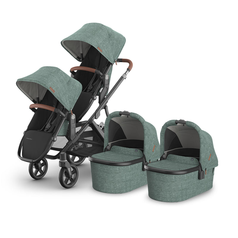 Angled view of UPPAbaby Vista V3 Twin Double Stroller in Gwen, includes bassinet and rumbleseat, a travel system stroller