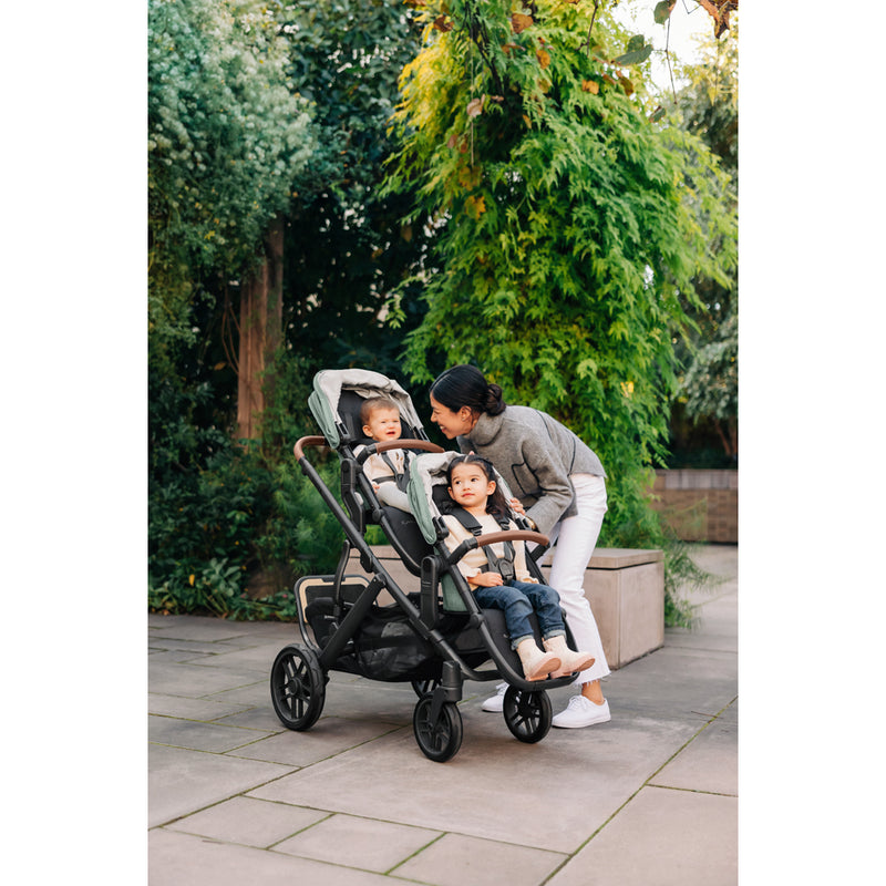 Trail walk with UPPAbaby Vista V3 Twin Double Stroller setup, featuring bassinet and toddler seat, twin stroller capability