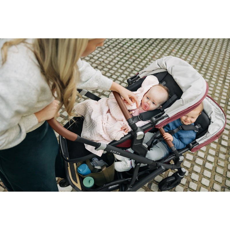 On the go with the UPPAbaby Vista V3 Twin Double Stroller in Greyson, ideal as a lightweight stroller for urban families