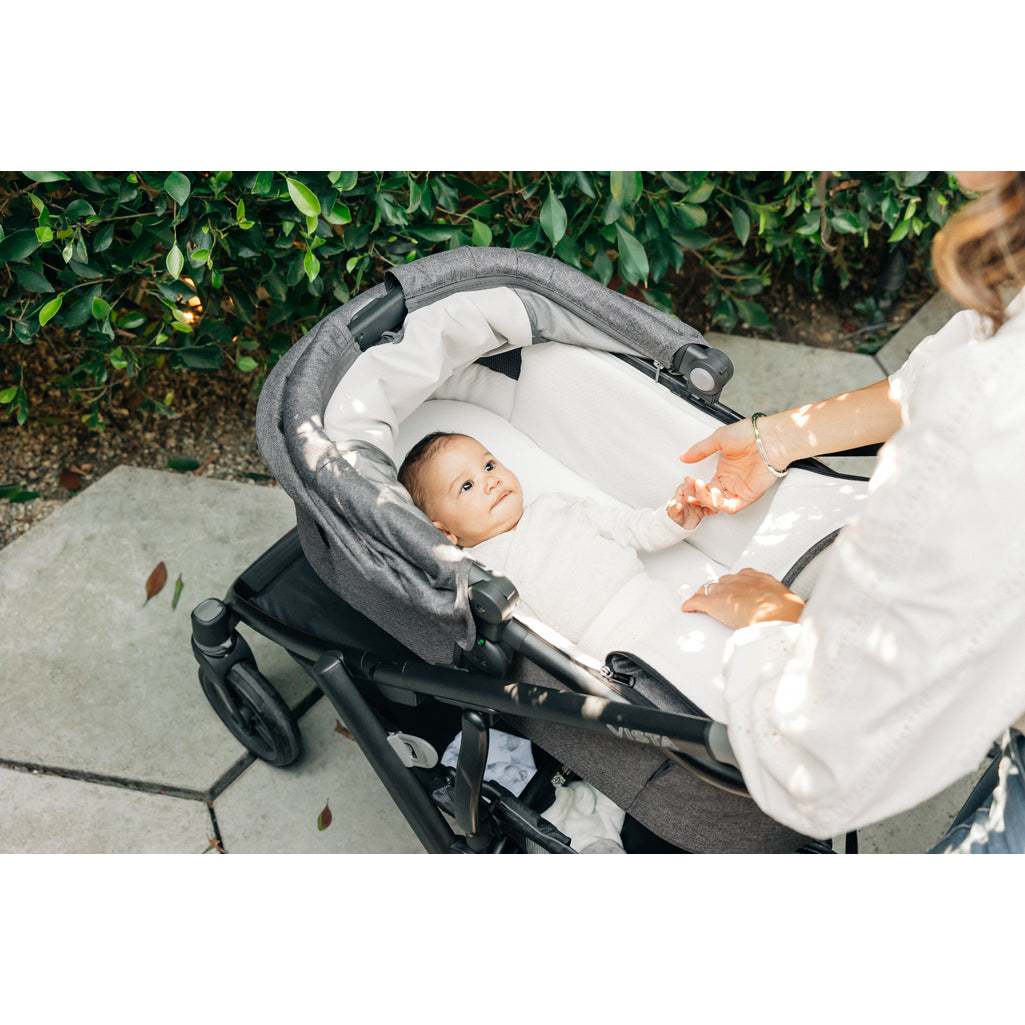 Sunlit view of UPPAbaby Vista V3 Twin Double Stroller in Callum, complete with bassinet and rumbleseat for stroller toddler seat function