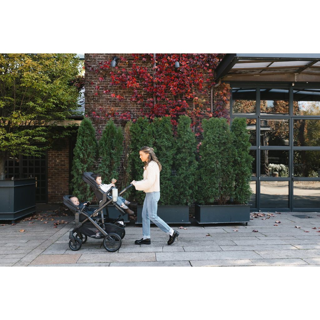 Side profile of the UPPAbaby Vista V3 Twin Double Stroller in Gwen, perfect single to double stroller for twins