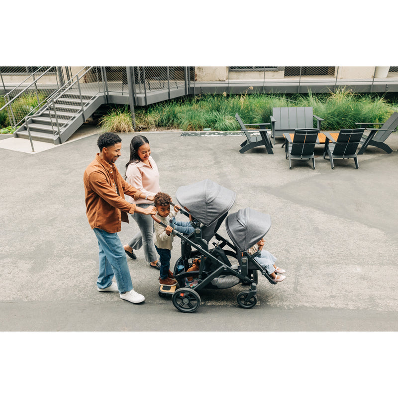 Outdoor view of the UPPAbaby Vista V3 Twin Double Stroller in Kenzi, highlighting the modular stroller setup with bassinet